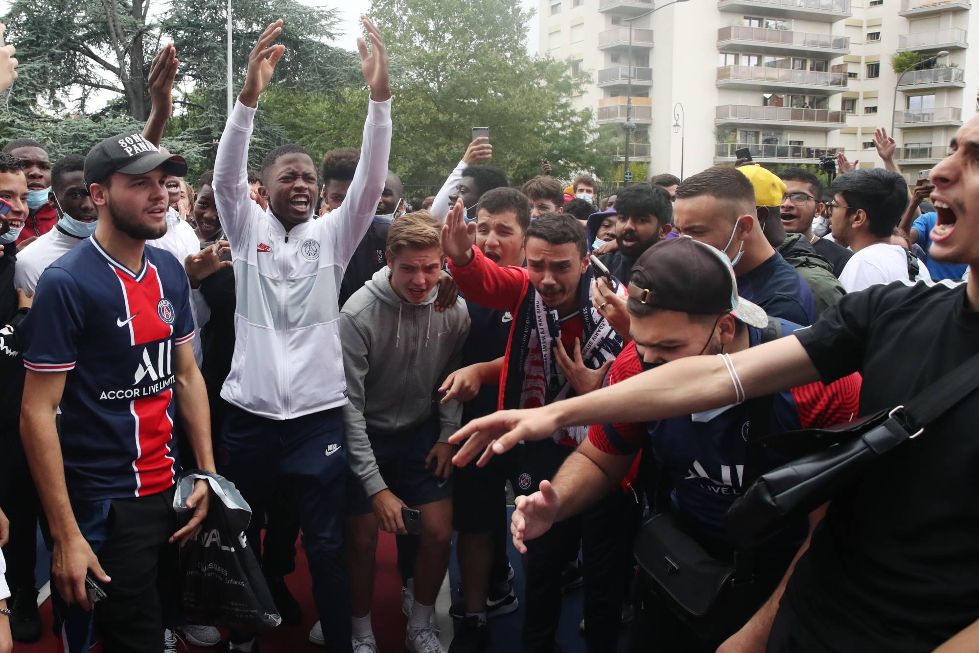 Fans await the arrival of Lionel Messi in Paris on Monday before his expected signing for Paris Saint-Germain. | Reuters 