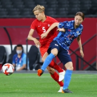 The single-named Quinn of Canada, who is a transgender non-binary soccer player, faces off against Japan\'s Yuzuho Shiokoshi on July 21. | REUTERS