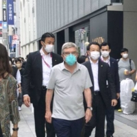 The man believed to be International Olympic Committee President Thomas Bach was seen walking in Tokyo\'s Ginza district on Monday. | COURTESY OF A PASSER-BY / VIA KYODO