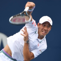 Kei Nishikori of Japan serves against Miomir Kecmanovic of Serbia in second round play in the National Bank Open, in Toronto, on Tuesday. | DAN HAMILTON / USA TODAY SPORTS / VIA REUTERS