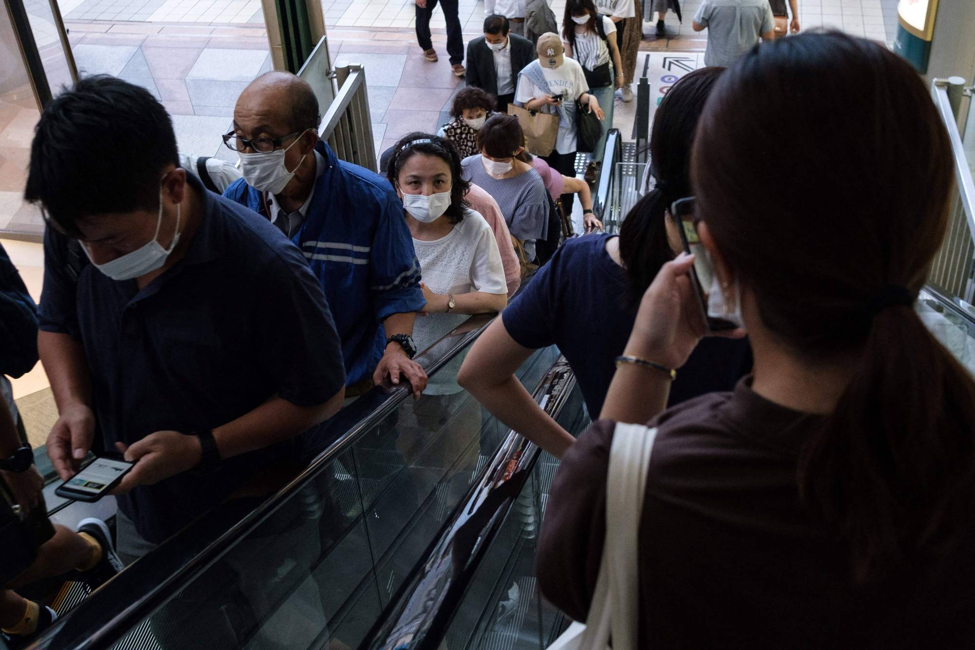 People in Tokyo's Shibuya district on Aug. 5 | AFP-JIJI