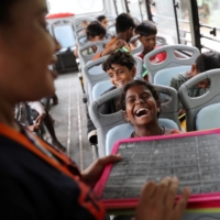 Gauri, 8, reacts during a class inside a parked bus run by TejasAsia in New Delhi on Monday.  | REUTERS 
