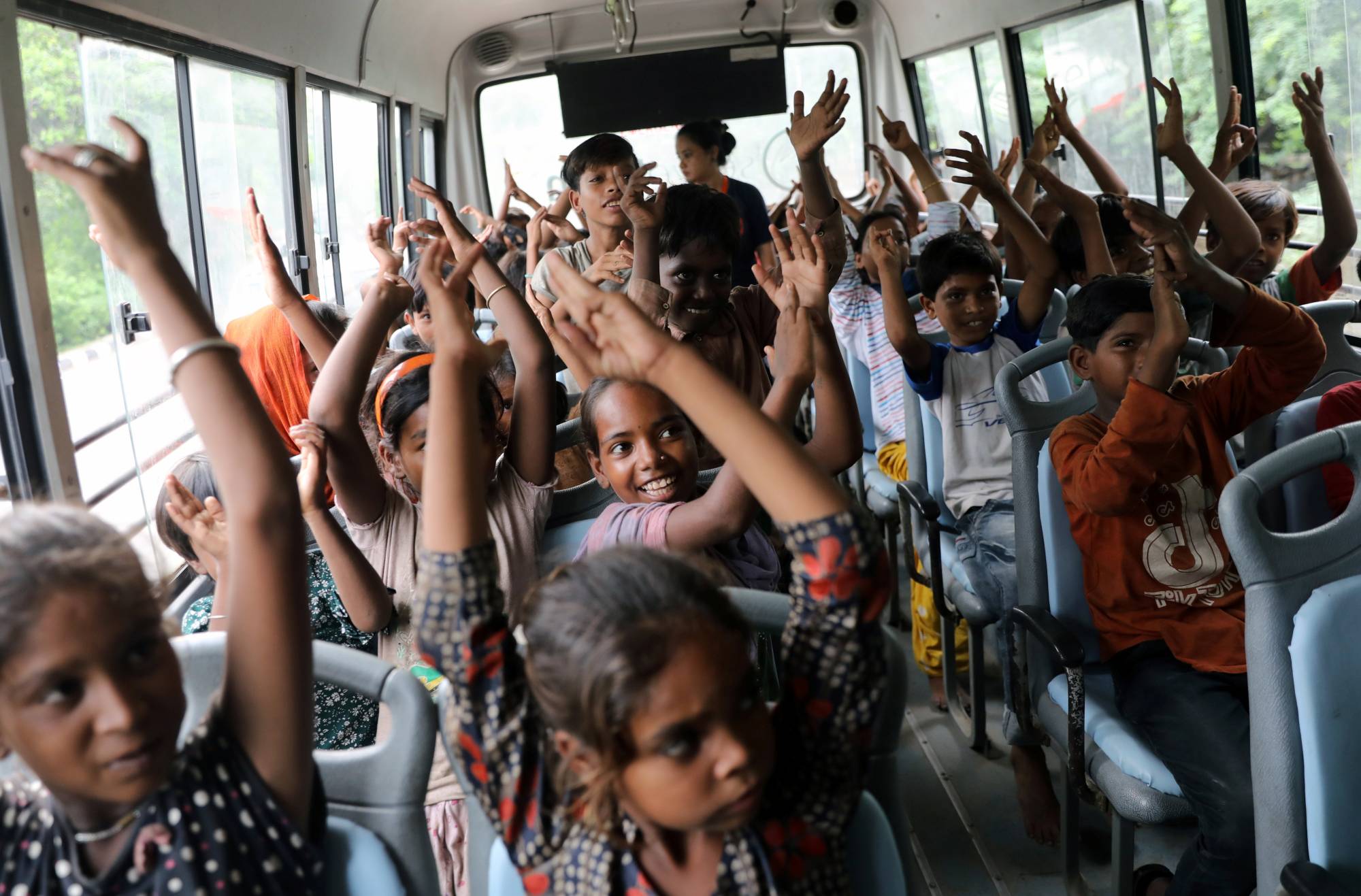 A TejasAsia class on a 'Hope Bus' on Monday | Reuters 