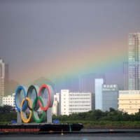A rainbow appears over Tokyo during a women’s triathalon event in Odaiba Marine Park. Though it doesn’t look like the Olympics will provide the city with any sort of pot of gold, much of Japan was instead satisfied with the record number of gold medals that their country took home from this year’s Games. | REUTERS
