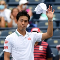 Japan\'s Kei Nishikori waves to fans after defeating Miomir Kecmanovic of Serbia in Toronto on Tuesday. | USA TODAY SPORTS / VIA REUTERS