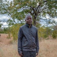 \"This whole bush can be razed to the ground if we don’t do what we’re doing,\" says Kembo Magonyo, a volunteer in Zimbabwe.  | BLOOMBERG 