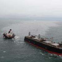 A view of the Panamanian-registered Crimson Polaris after it ran aground in Hachinohe harbor in Aomori Prefecture on Thursday | 2ND REGIONAL COAST GUARD HEADQUARTERS – JAPAN COAST GUARD / VIA REUTERS