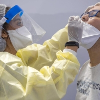 The now-dominant COVID-19 delta variant spreads so quickly that every missed opportunity to catch an infectious person can lead to many more new cases. | AFP-JIJI