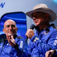 Billionaire American businessman Jeff Bezos alongside his brother Mark at a post-launch news conference on July 20.  | REUTERS