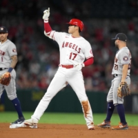 Los Angeles Angels designated hitter Shohei Ohtani reacts after hitting an RBI single in the eight inning on Friday.  | USA TODAY / VIA REUTERS