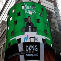 DraftKings\' CEO Jason Robins appears on the Nasdaq MarketSite jumbotron ahead of the company\'s initial public offering, in New York on June 11. | REUTERS