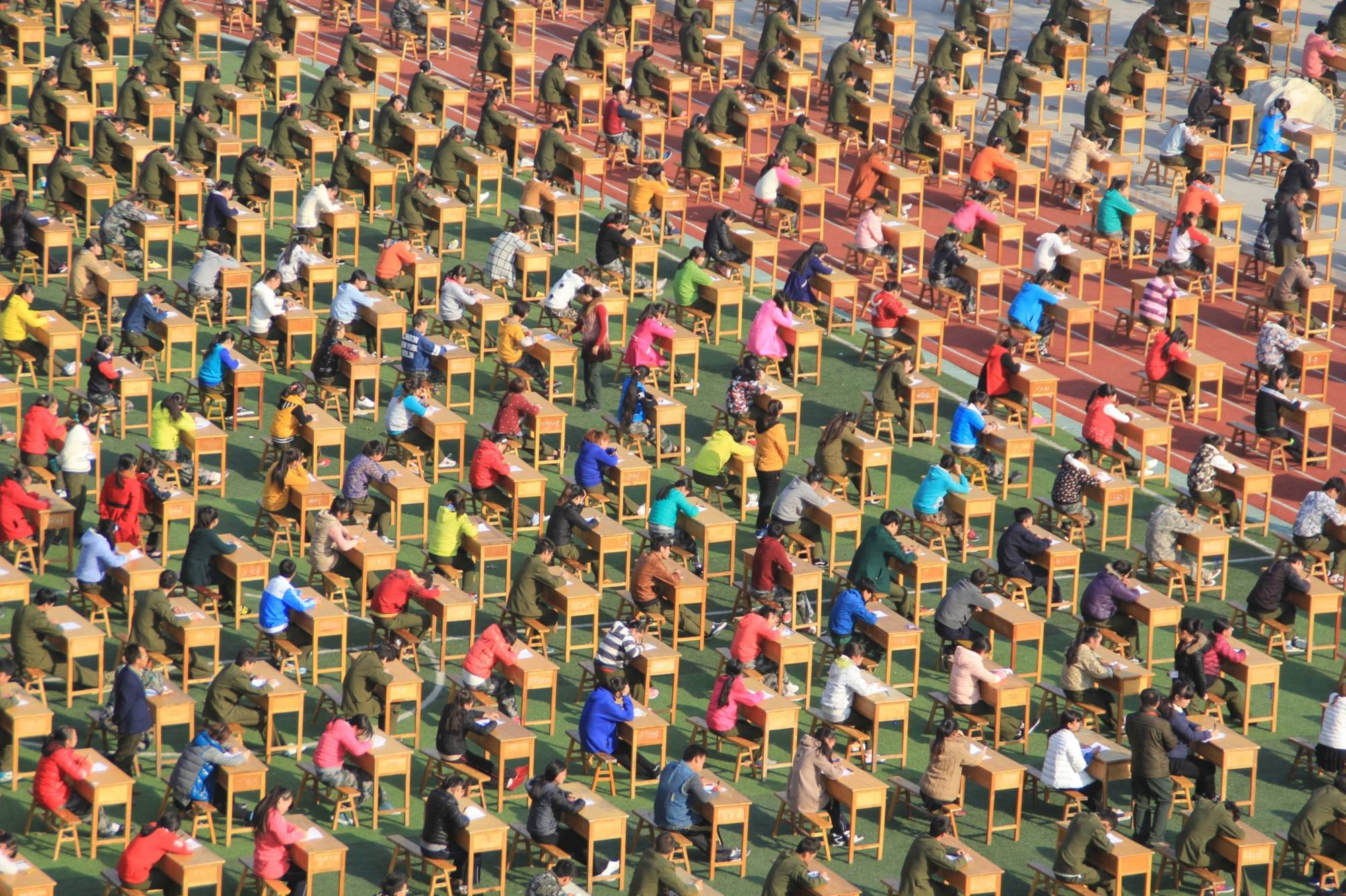 Thousands of students sit for a test In Baoji, China. | GETTY IMAGES / VIA BLOOMBERG 