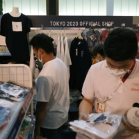 People shop in an official Olympics store in Tokyo on July 30.  | REUTERS