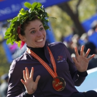 Amanda McGrory reacts after winning the women\'s wheelchair division of the New York City Marathon on Nov. 6, 2011 in New York. | REUTERS