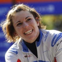 Amanda McGrory smiles after winning the women\'s wheelchair division of the 2011 New York City Marathon on Nov. 6, 2011 in New York. | REUTERS