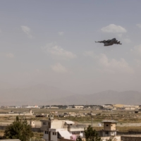 A military cargo plane takes off from the airport in Kabul on Saturday.  | JIM HUYLEBROEK / THE NEW YORK TIMES