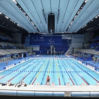 Paralympic swimmers practice at the Tokyo Aquatics Centre on Friday. | KYODO