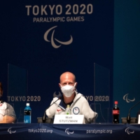 From left: Mexio\'s Amalia Perez, Matt Stutzman of the United States, and Uganda\'s Husnah Kukundawke speak during a news conference at Tokyo Big Sight. | AFP-JIJI