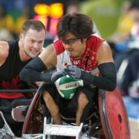 Daisuke Ikezaki carries the ball during the bronze medal match of the 2016 Olympic wheelchair rugby competition in Rio de Janeiro. | REUTERS