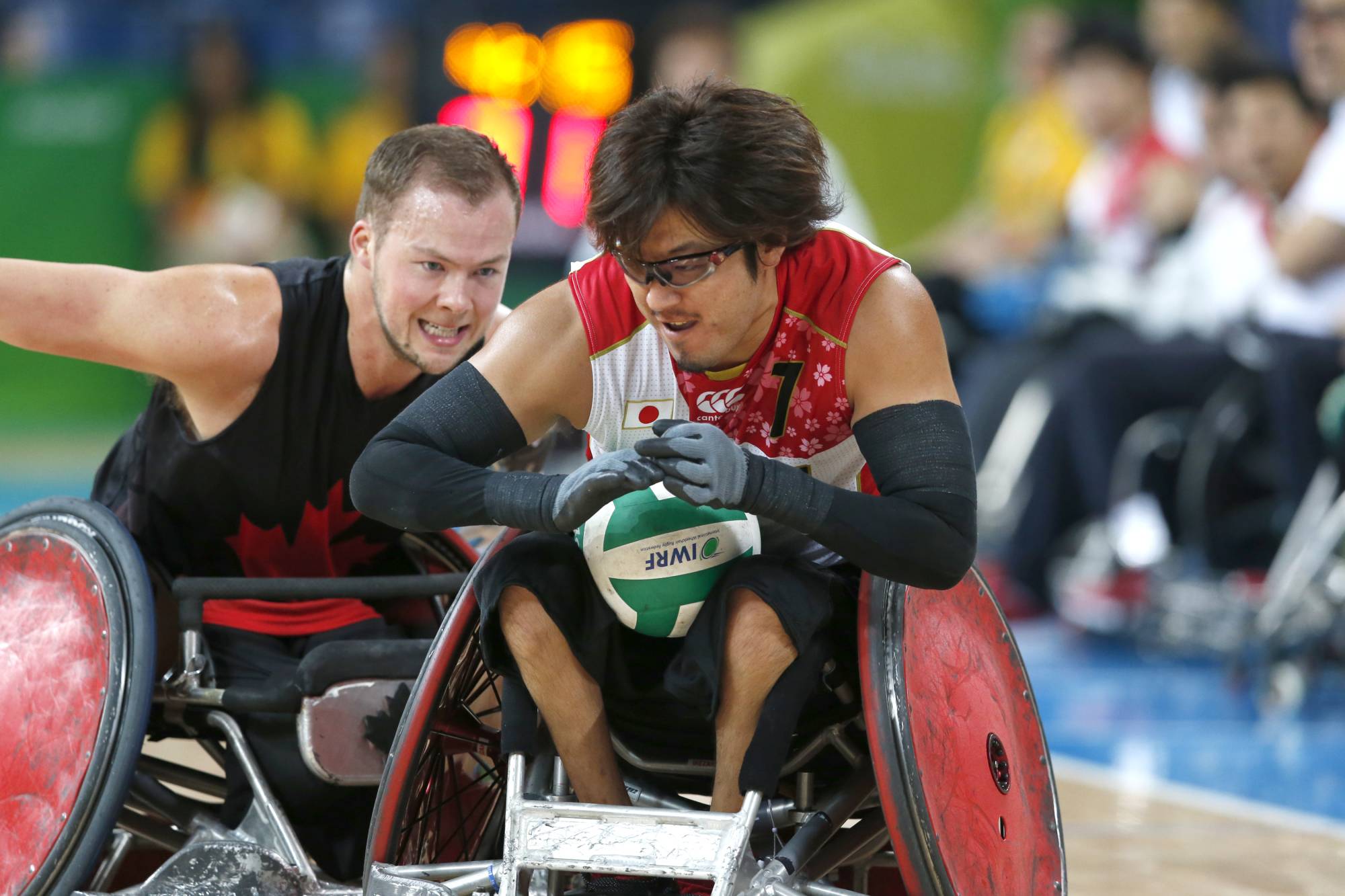 Daisuke Ikezaki carries the ball during the bronze medal match of the 2016 Olympic wheelchair rugby competition in Rio de Janeiro. | REUTERS