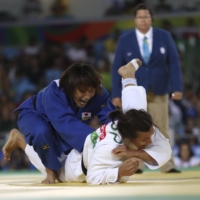 Junko Hirose (left) competes against Spain\'s Maria Monika Merenciano Herrero during the 2016 Rio Games. | REUTERS