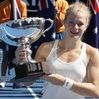 Diede de Groot of Netherlands poses with the trophy after winning the women\'s wheelchair singles final at the Australian Open in January 2018. | REUTERS