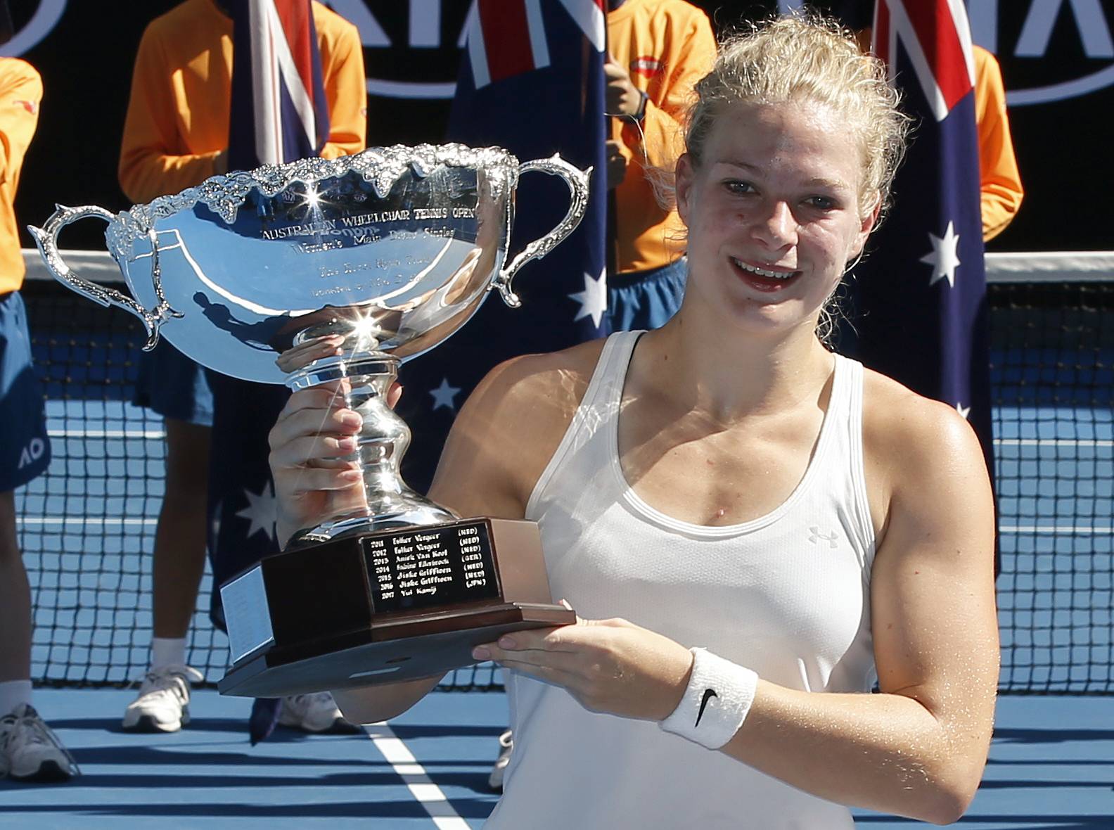 Diede de Groot of Netherlands poses with the trophy after winning the women's wheelchair singles final at the Australian Open in January 2018. | REUTERS