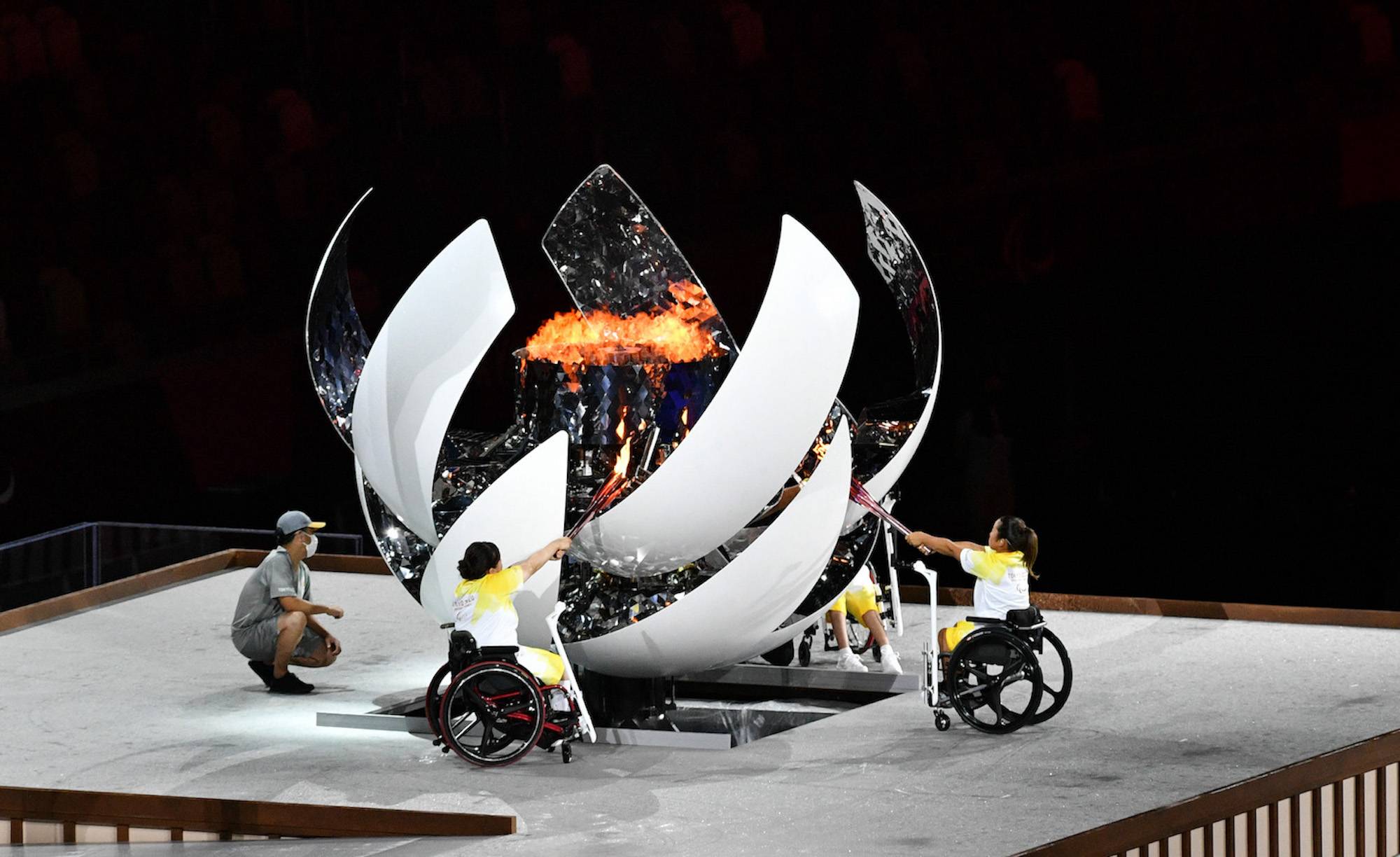 Japanese athletes light the Paralympic flame at the opening ceremony | DAN ORLOWITZ 