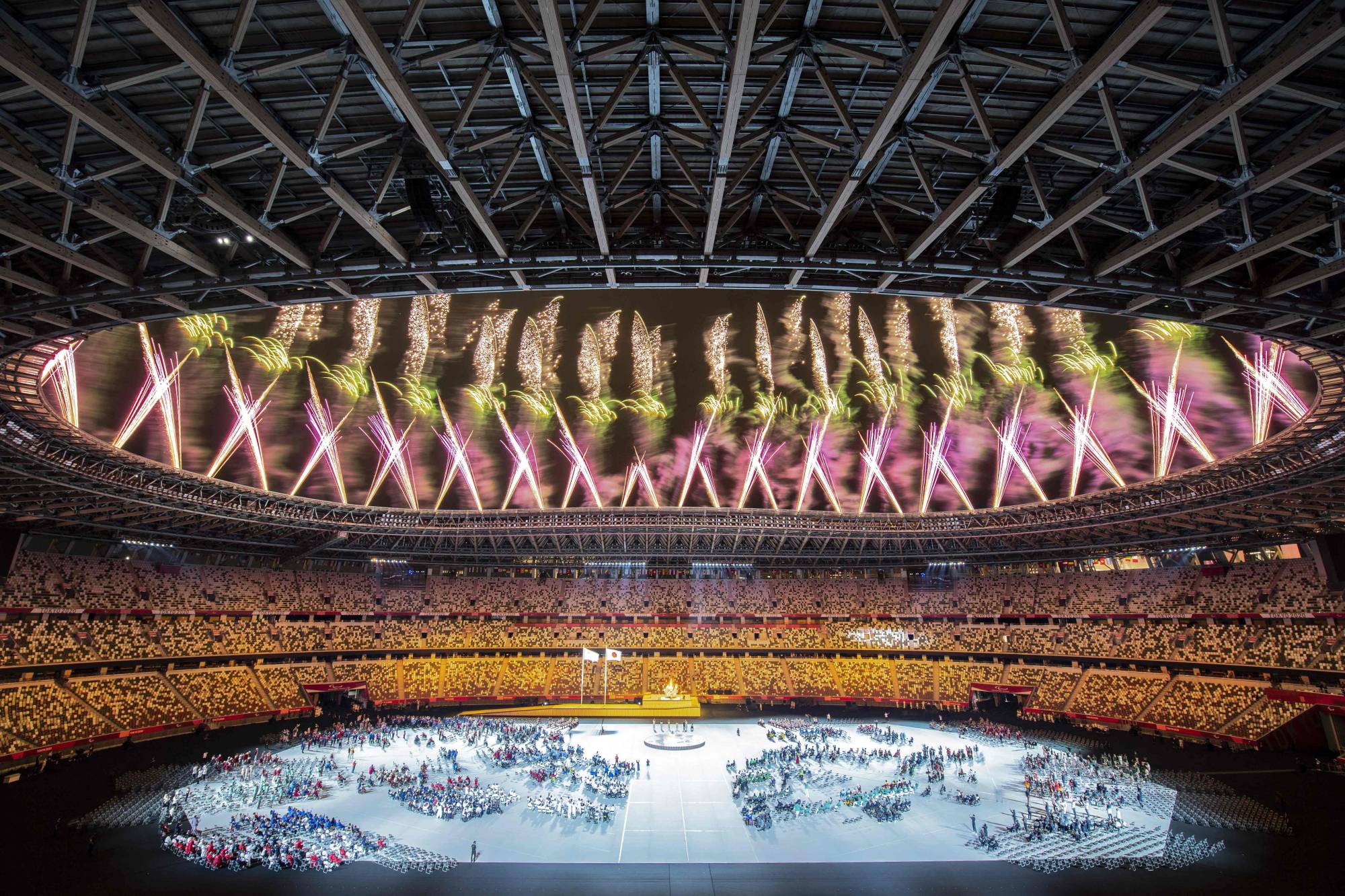 Fireworks explode above the National Stadium during the opening ceremony. | AFP-JIJI