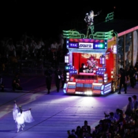 A scene from the opening ceremony\'s performance featuring the \"Dazzling Truck\" driven by the ALS creator Eye VDJ Masa | REUTERS