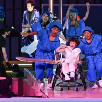 Performers with the star of the opening ceremony\'s performance, the Little One-Winged Plane, played by 13-year-old Yui Wago | AFP-JIJI