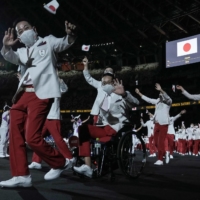 Team Japan arrives for the opening ceremony | AFP-JIJI