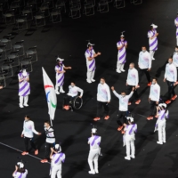 The Refugee Olympic Team enter the stadium  | BLOOMBERG
