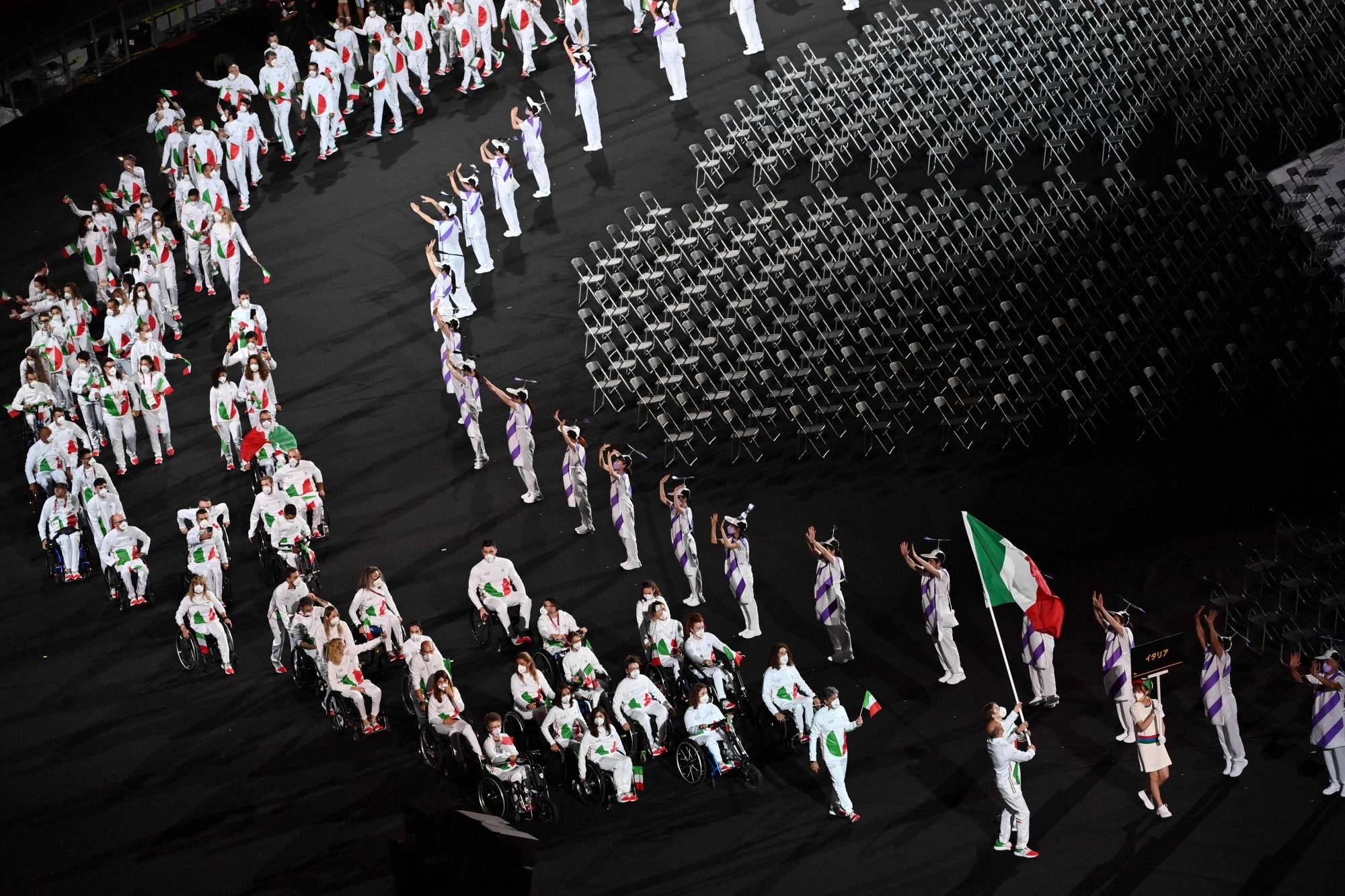 Italy's team arrives at the opening ceremony for the Tokyo 2020 Paralympic Games | AFP-JIJI