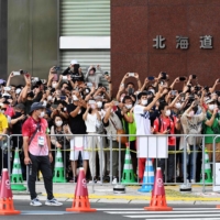 Spectators watch the Olympic men\'s marathon in Sapporo on Aug. 8.  | AFP-JIJ