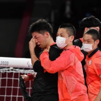 Members of Japan\'s men\'s Paralympic goalball team celebrate following their 13-4 win over Algeria on Wednesday in Chiba.  | DAN ORLOWITZ 
