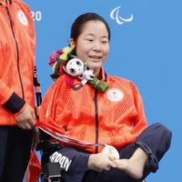 Miyuki Yamada poses with her medal on Wednesday.  | KYODO