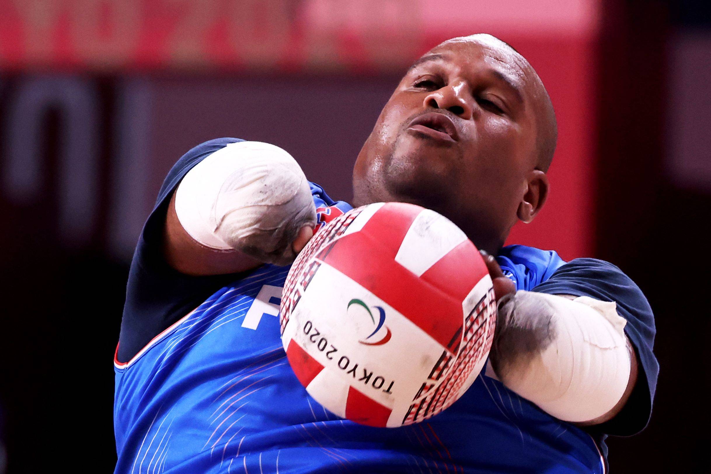 France's Cedric Nankin catches the ball during the pool phase group A wheelchair rugby match between France and Japan. | AFP-JIJI