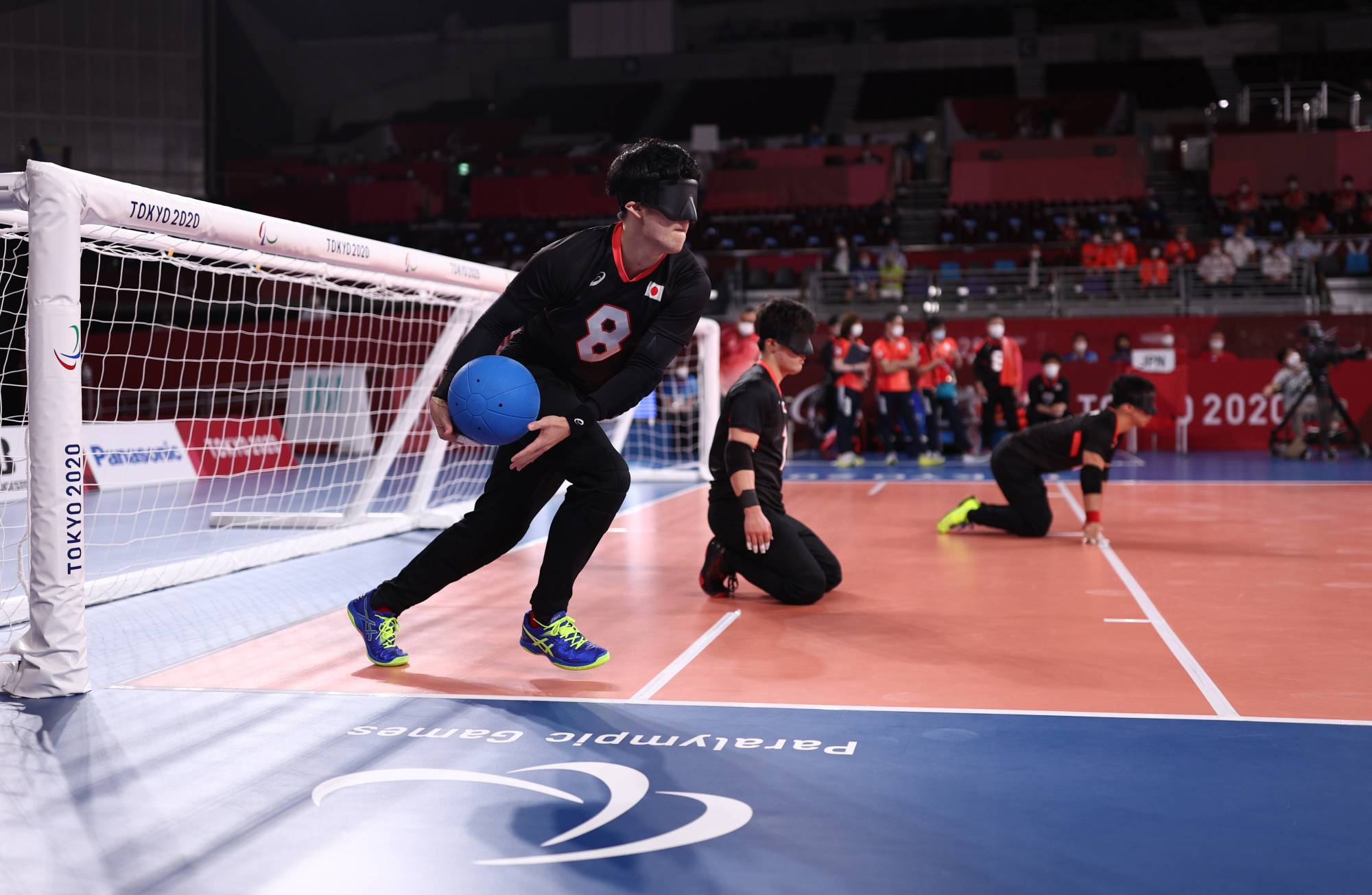 Japan plays Algeria in a Paralympic men's goalball match at Makuhari Messe in Chiba on Wednesday. | REUTERS