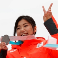 Momoka Muraoka of Japan celebrates with her silver medal in the women\'s sitting slalom at the 2018 Winter Paralympics.  | REUTERS