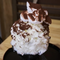 The milk-cocoa kakigōri at Momijiya is an adult treat with a nostalgic vibe. The whipped cream is an extra add-on, but don’t skip it. | ALEX FISHER

