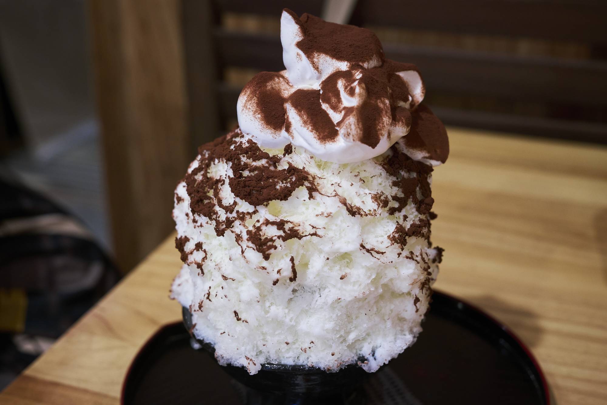 The milk-cocoa kakigōri at Momijiya is an adult treat with a nostalgic vibe. The whipped cream is an extra add-on, but don’t skip it. | Alex Fisher 