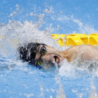 Swimmer Takayuki Suzuki races to gold in the men\'s 100-meter freestyle S4 class.  | KYODO 