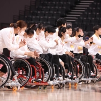 Team China celebrate after winning a preliminary round of wheelchair basketball against the Netherlands | REUTERS