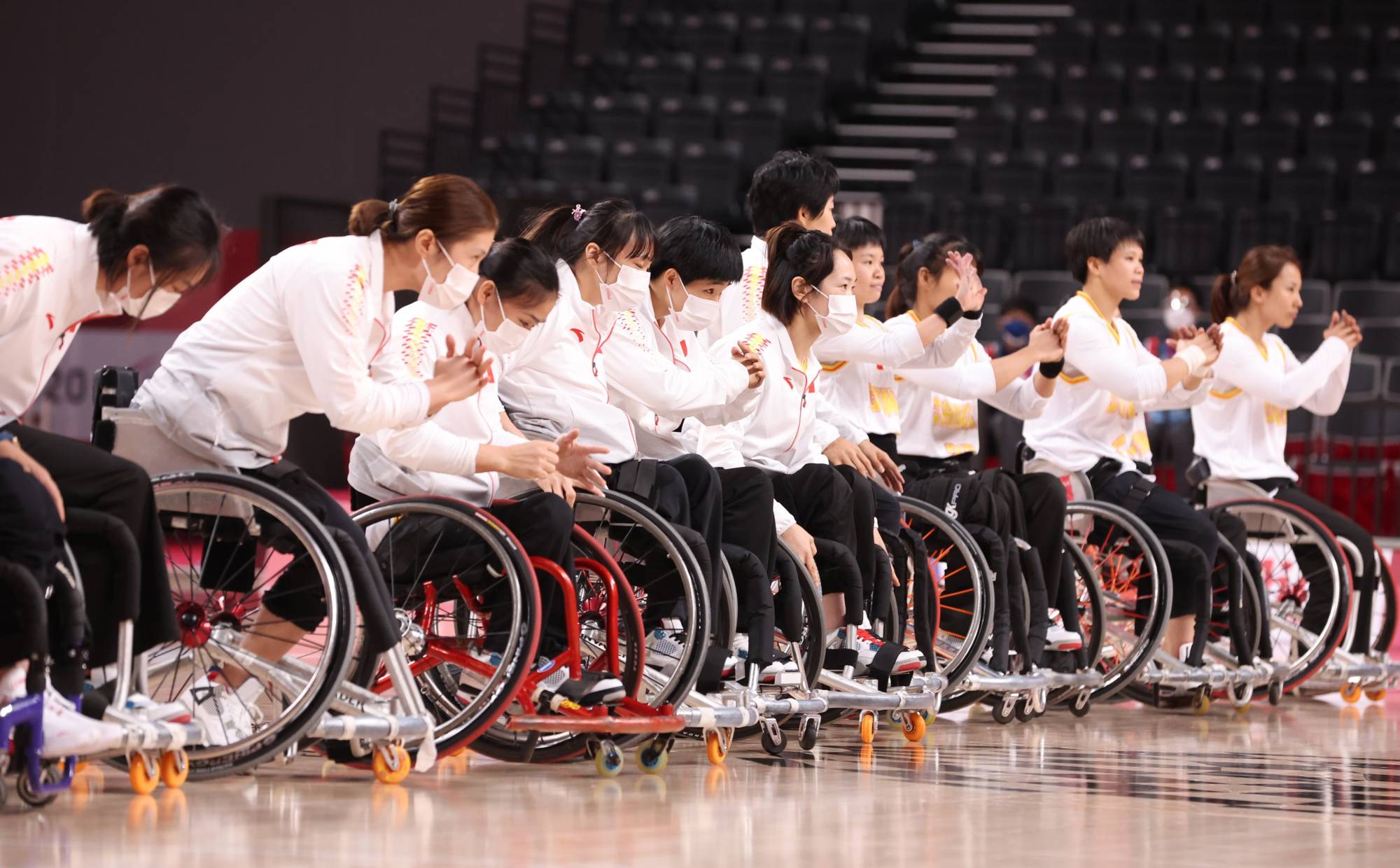 Team China celebrate after winning a preliminary round of wheelchair basketball against the Netherlands | REUTERS