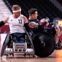 Players vie for the bar during the wheelchair rugby match between Britain and New Zealand | AFP-JIJI