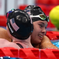 USA\'s Gia Pergolini hugs teammate Colleen Young after winning gold and setting a world record in the women\'s 100-meter backstroke (S13) | REUTERS