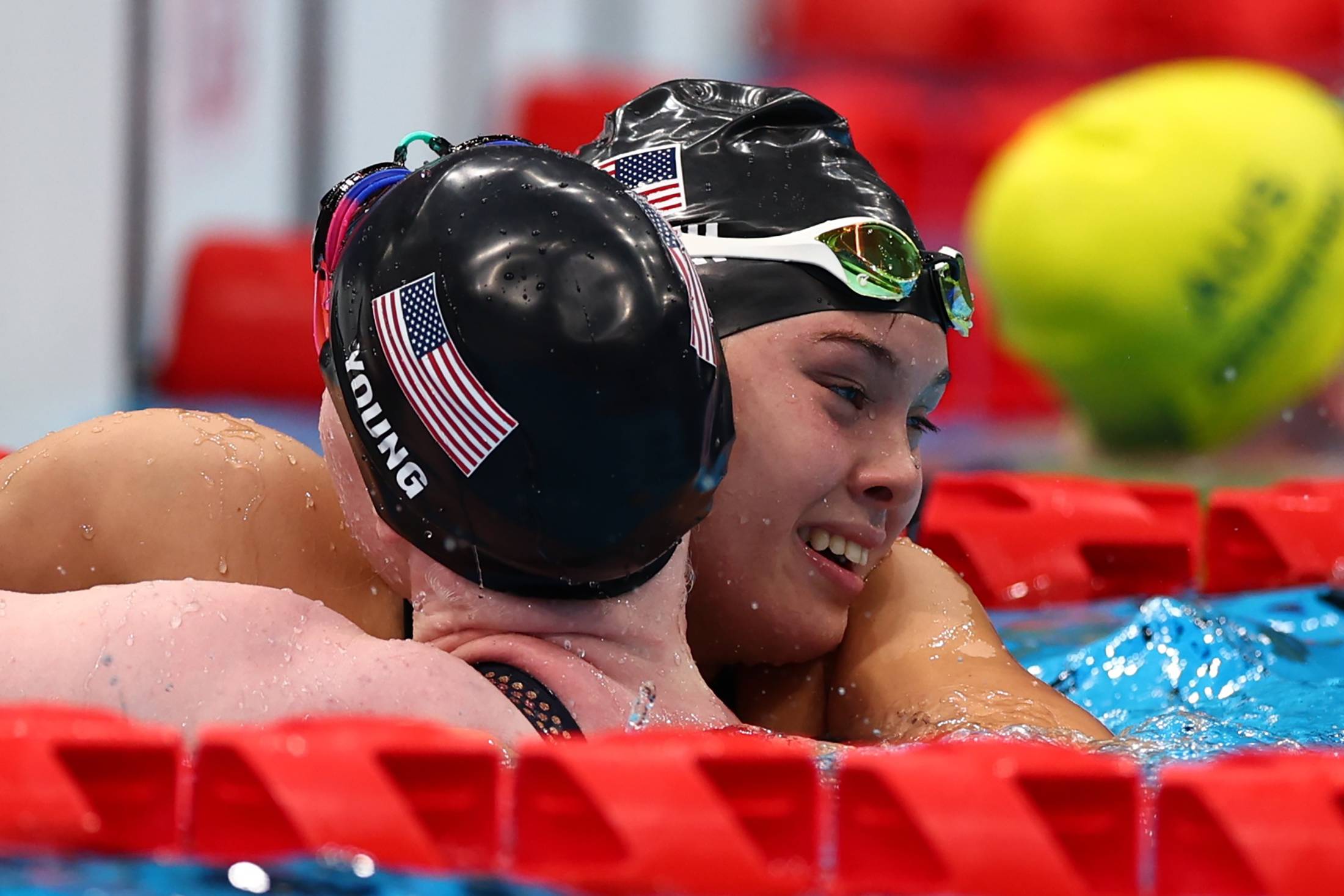USA's Gia Pergolini hugs teammate Colleen Young after winning gold and setting a world record in the women's 100-meter backstroke (S13) | REUTERS