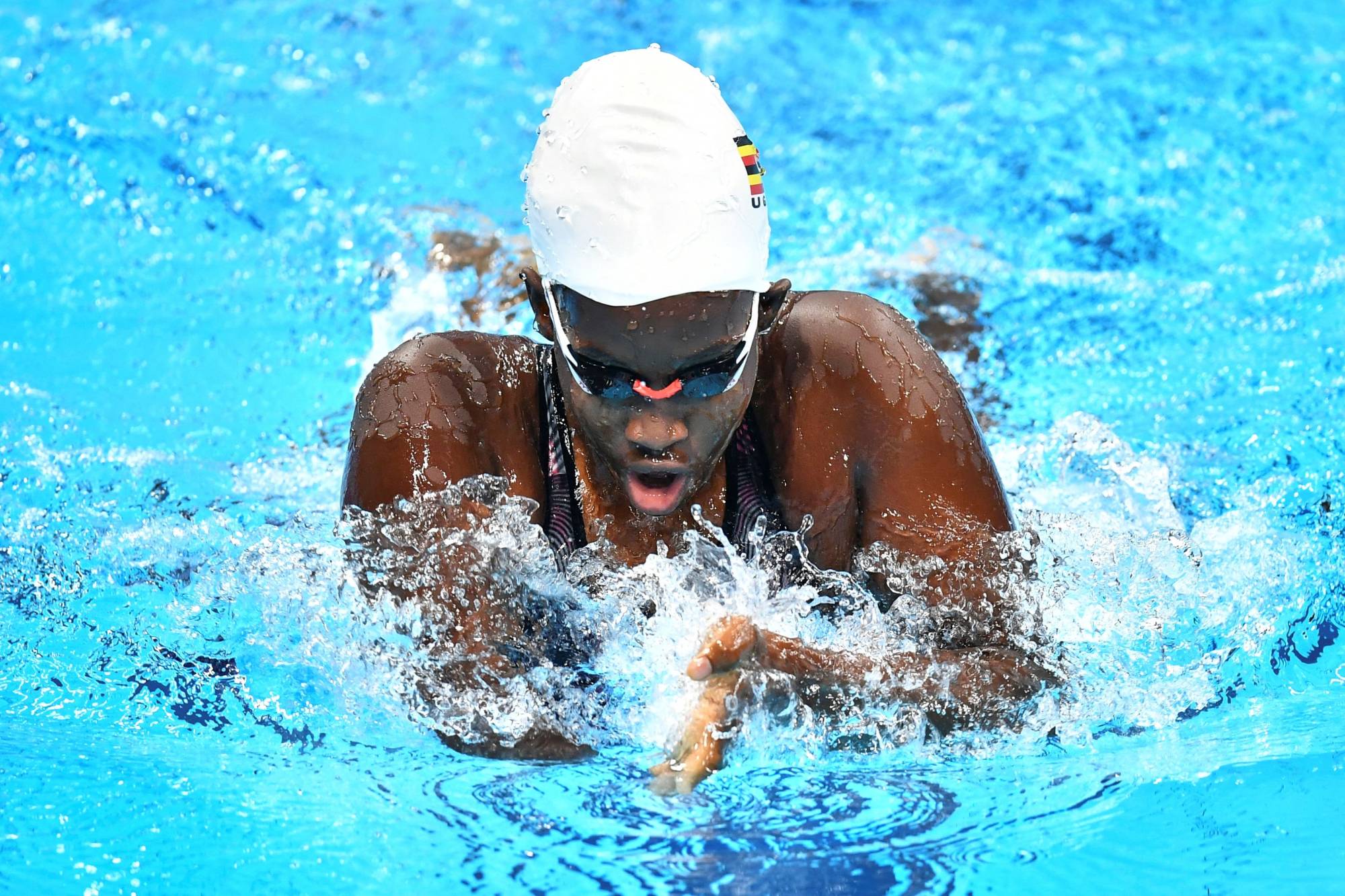 Uganda's Husnah Kukundakwe in a heat of the women's 100-meter breaststroke | AFP-JIJI