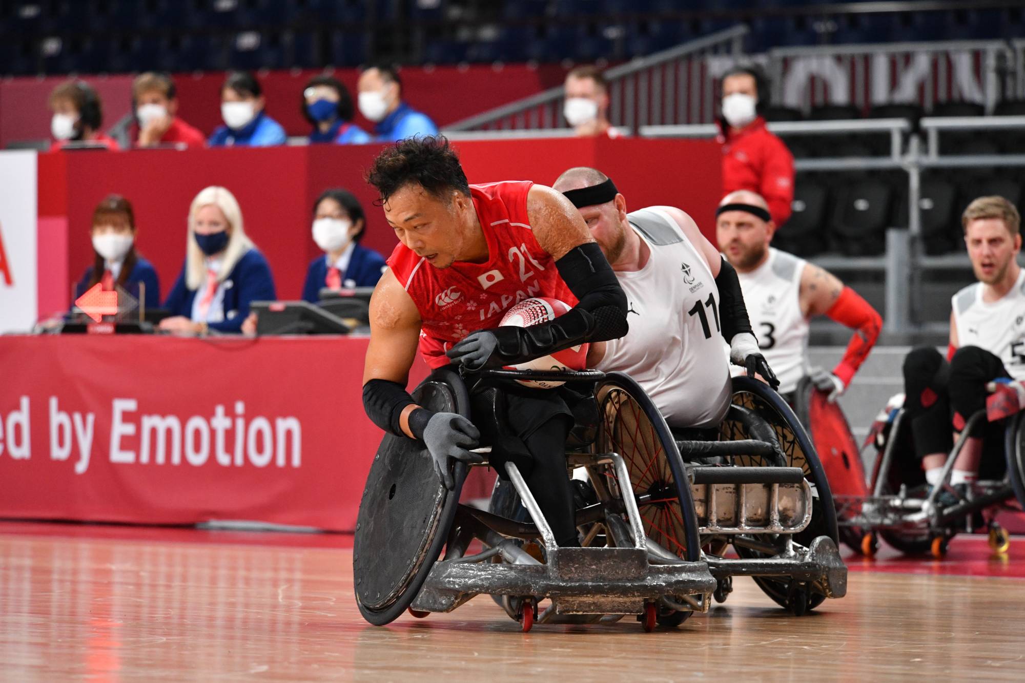 Yukinobu Ike is pursued by Denmark's Mark Ingemann Peters during Japan's group stage victory | DAN ORLOWITZ 